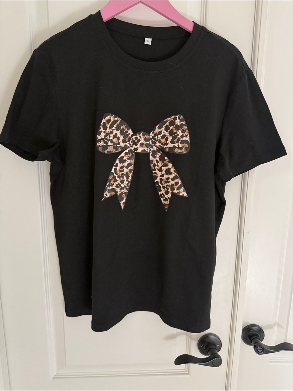 Black womens T-Shirt with Leopard Bow Graphic. Never worn.